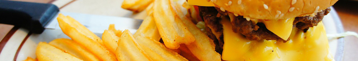 Eating Brazilian Burger at Hamburgao - Newark NJ restaurant in Newark, NJ.